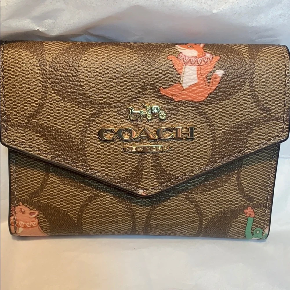 NWT Coach limited edition leashed wallet w/mirror